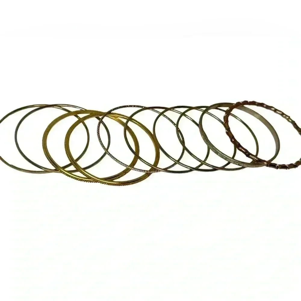 Multiple gold bangle bracelets random assortment of gold colored bracelets